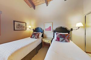 two beds in a room with two lamps at Timberline Condominiums 3 Bedroom Standard Unit D3A in Snowmass Village +15 photos