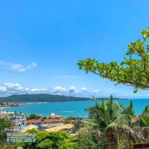 a view of the ocean from a resort at Residencial Bombinhas Vista Mar in Bombinhas