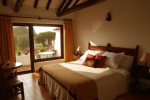 Ένα ή περισσότερα κρεβάτια σε δωμάτιο στο Hotel Mesón de los Virreyes