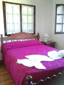 Кровать или кровати в номере Las Achiras, Casas de Campo