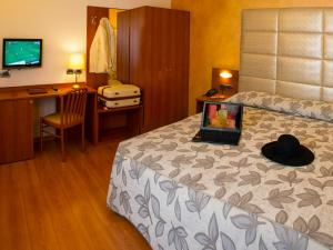 Postel nebo postele na pokoji v ubytování Hotel Doge