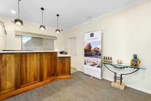 a room with a counter and a display case at Beechworth Motor Inn in Beechworth