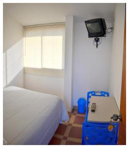 TV a/nebo společenská místnost v ubytování Hospedaje La Casa Blanca