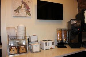 a kitchen with a counter top and a microwave at Inn on Folsom in San Francisco