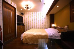 Postel nebo postele na pokoji v ubytování Hotel Ohirune Racco Higashiosaka ( Adult Only)