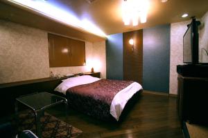 Postel nebo postele na pokoji v ubytování Hotel Ohirune Racco Higashiosaka ( Adult Only)