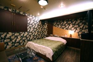 Postel nebo postele na pokoji v ubytování Hotel Ohirune Racco Higashiosaka ( Adult Only)