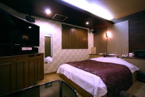Postel nebo postele na pokoji v ubytování Hotel Ohirune Racco Higashiosaka ( Adult Only)