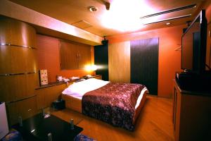 Postel nebo postele na pokoji v ubytování Hotel Ohirune Racco Higashiosaka ( Adult Only)