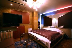 Postel nebo postele na pokoji v ubytování Hotel Ohirune Racco Higashiosaka ( Adult Only)