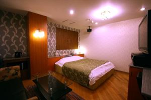 Postel nebo postele na pokoji v ubytování Hotel Ohirune Racco Higashiosaka ( Adult Only)
