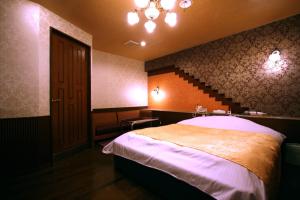 Postel nebo postele na pokoji v ubytování Hotel Ohirune Racco Higashiosaka ( Adult Only)