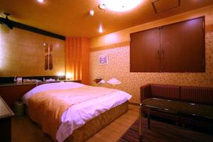 Postel nebo postele na pokoji v ubytování Hotel Ohirune Racco Higashiosaka ( Adult Only)