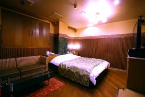 Postel nebo postele na pokoji v ubytování Hotel Ohirune Racco Higashiosaka ( Adult Only)