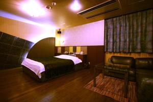 Postel nebo postele na pokoji v ubytování Hotel Ohirune Racco Higashiosaka ( Adult Only)