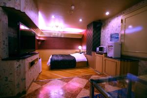 Postel nebo postele na pokoji v ubytování Hotel Ohirune Racco Higashiosaka ( Adult Only)