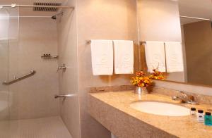 a bathroom with a sink and a shower at Hotel Estelar El Cable in Manizales +12 photos
