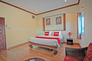 Cama o camas de una habitación en OYO 1117 Phuket Airport Suites