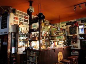 a bar filled with lots of bottles of alcohol at Pension Alfa & Whisky Pub in Tábor