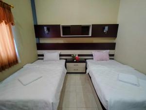 מיטה או מיטות בחדר ב-Hotel Pilar Mosa