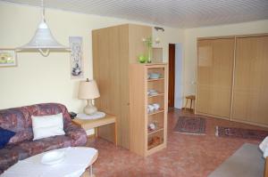 a living room with a couch and a table at Haus Barbara in Hilders