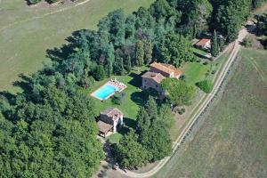 an aerial view of a house with a swimming pool at Salceta, a Tuscany Country House in Campogialli