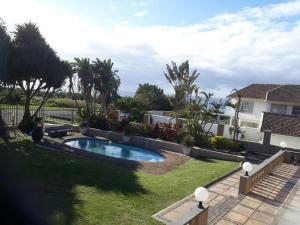 A view of the pool at Uvongo Destiny4u Retreat or nearby