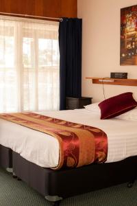 Ένα ή περισσότερα κρεβάτια σε δωμάτιο στο Manjimup Motor Inn