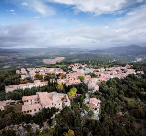 an aerial view of a town with buildings and trees at CASA MAIRA IN CENTRO A SATURNIA in Saturnia