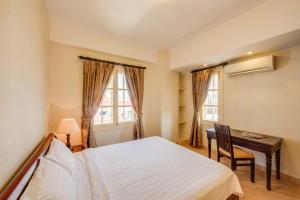 Postel nebo postele na pokoji v ubytování City View Apartment