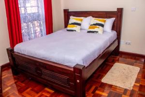 Llit o llits en una habitació de Kasty M Apartments- W Place