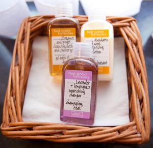 a wicker basket with four bottles of essential oils at The Townhouse Hotel in Melrose