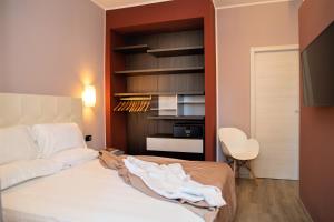 Posteľ alebo postele v izbe v ubytovaní Tuscany Hotel Alle Dune