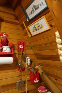 a room with a wooden cabin with utensils at Ethno Cottage "Biljana" in Zlatibor