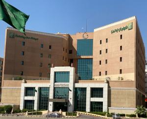 a large building with a flag in front of it at Holiday Inn Olaya, an IHG Hotel in Riyadh