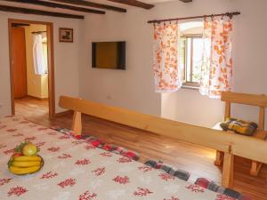 a bedroom with a bed with bananas on it at Holiday Home Elija by Interhome in Mošćenička Draga +32 photos