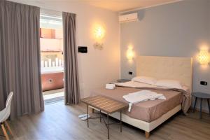 Posteľ alebo postele v izbe v ubytovaní Tuscany Hotel Alle Dune
