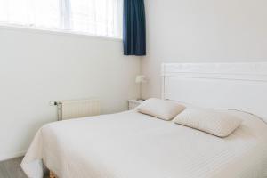 Katil atau katil-katil dalam bilik di Hotel Lemmer