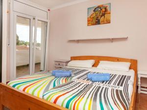 Llit o llits en una habitació de Holiday Home Casa Higea by Interhome