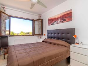 a bedroom with a large bed and a window at Apartment Bellavista I by Interhome in Orihuela