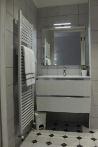 a white bathroom with a sink and a mirror at MY BED affittacamere in Cuneo +11 photos