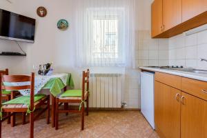 Kuchyňa alebo kuchynka v ubytovaní Apartments Marissimo