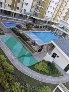 an overhead view of a swimming pool in a building at Mesaverte Residences AFS Suites in Cagayan de Oro