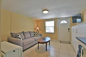 a living room with a couch and a table at Siesta Key Beach - Bari 665 #2 in Siesta Key