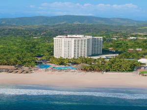 an aerial view of a hotel on a beach at Sunscape Dorado Pacifico Ixtapa Resort & Spa- All Inclusive in Ixtapa
