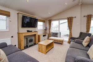 Χώρος καθιστικού στο 2 bedroom Lodge at Pevensey Bay