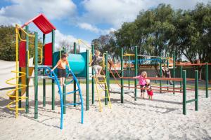 a small child's playground with a lot of toys at Discovery Parks - Perth Airport in Perth