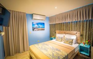 Ένα ή περισσότερα κρεβάτια σε δωμάτιο στο El Navegante de Culebra