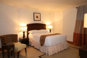 Ένα ή περισσότερα κρεβάτια σε δωμάτιο στο Crown Regency Suites Mactan