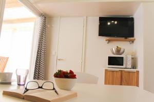 Televízia a/alebo spoločenská miestnosť v ubytovaní SweetHome